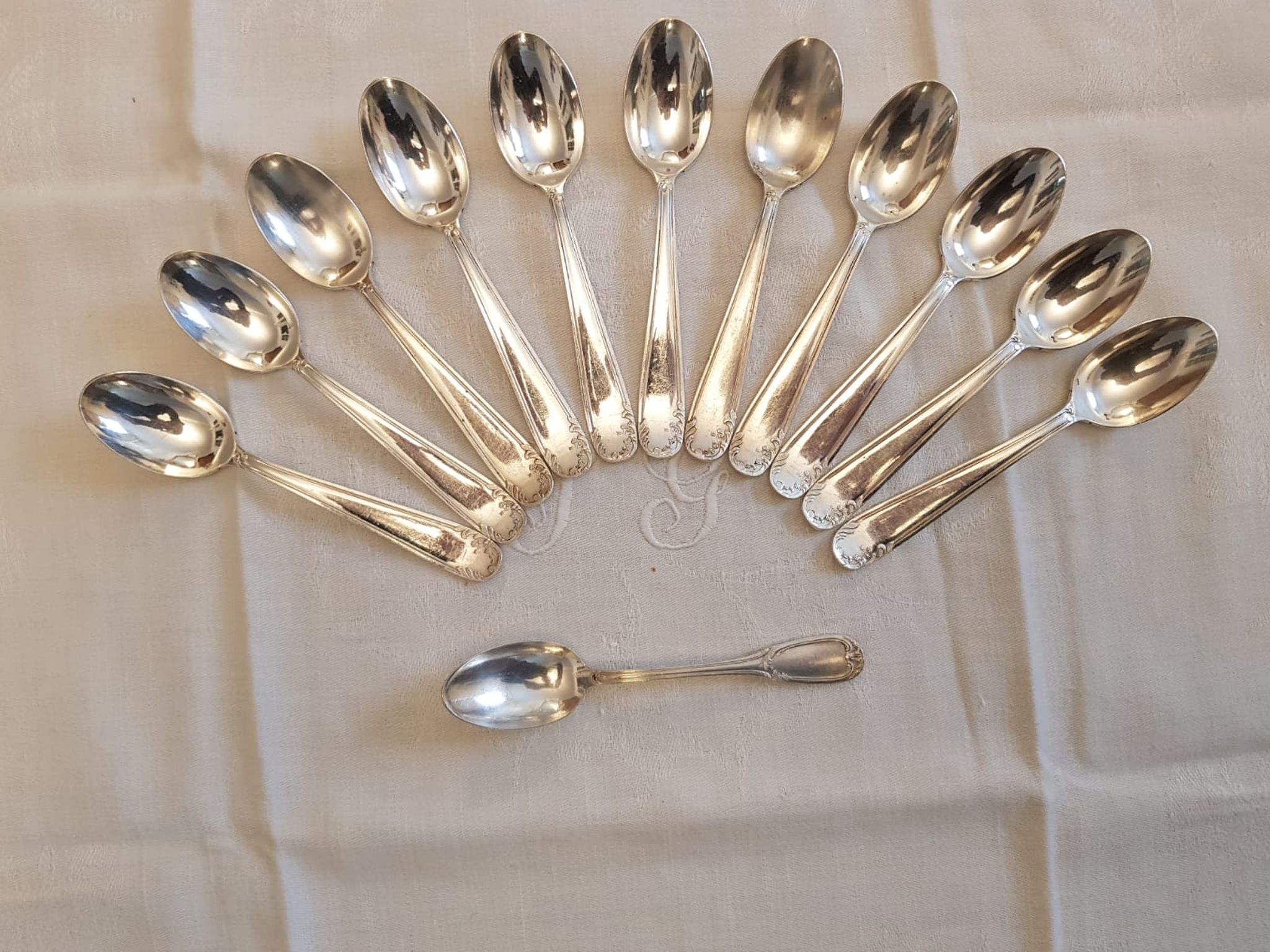 Silver cutlery set for 36 place settings and its ladle.