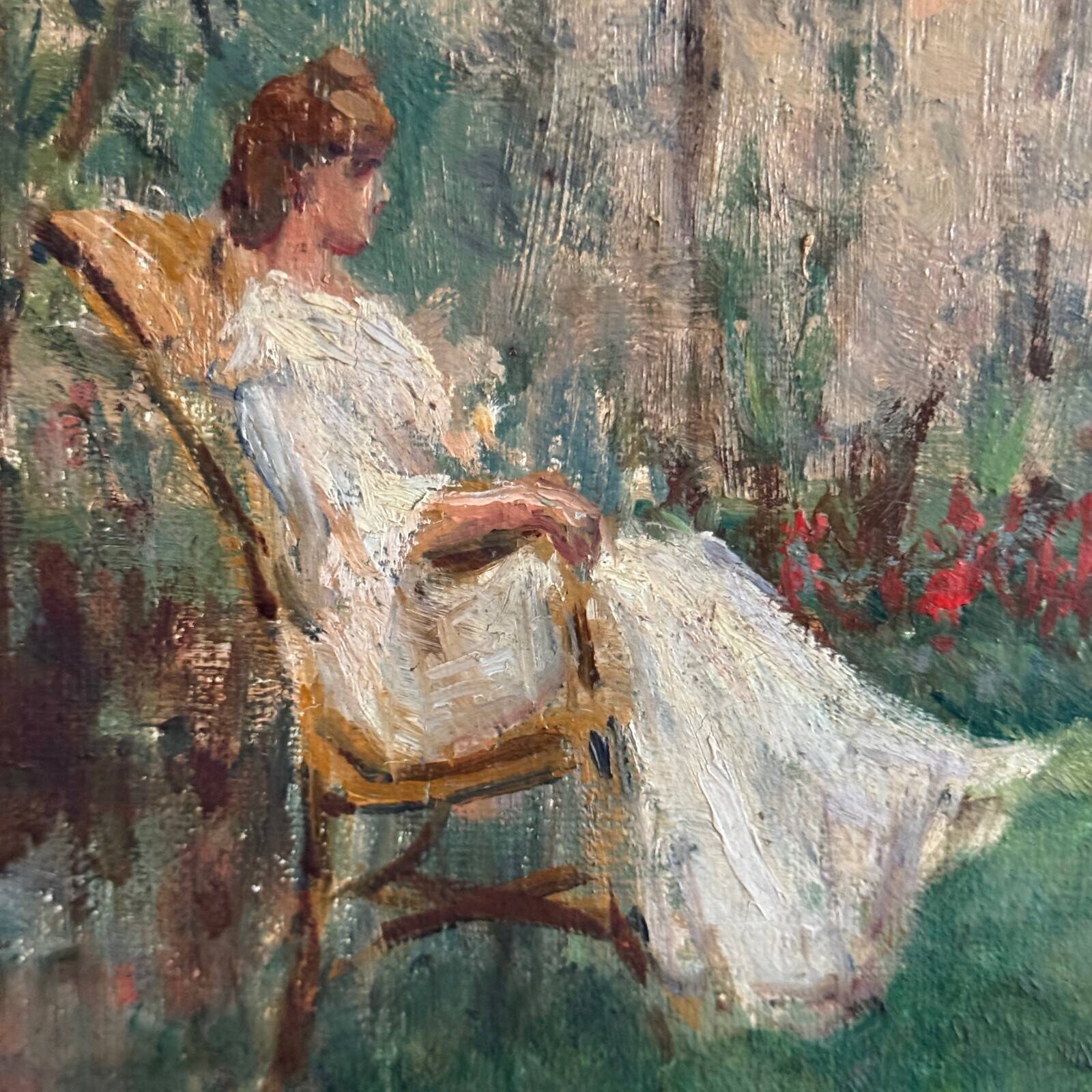 Oil on canvas park scene with a woman sitting in an armchair