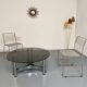Round coffee table in smoked glass and chrome steel, 1970s design.
