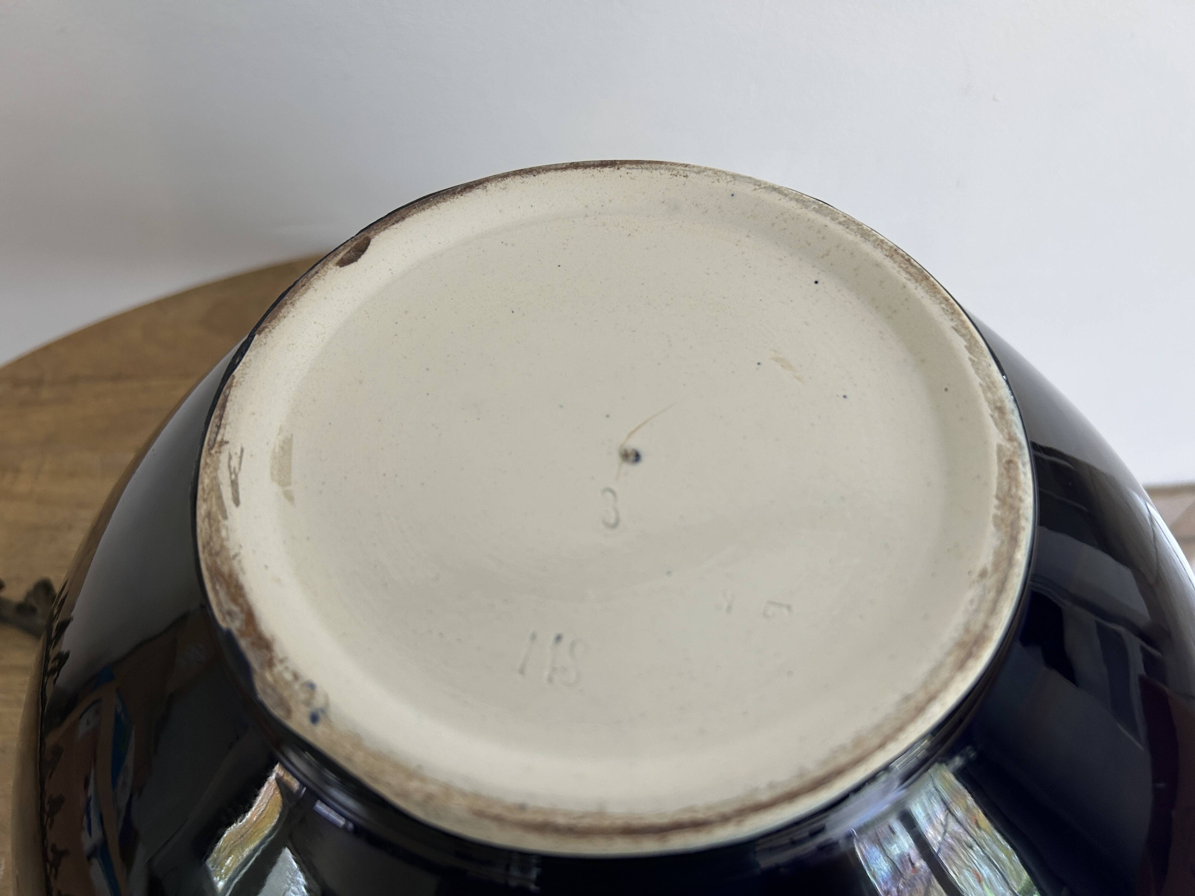 Ceramic cache-pot with bronze frame