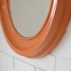 Orange vintage round wall plastic mirror 1980s, space age vanity mirror