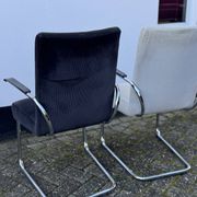 Paire de fauteuils en acier tubulaire