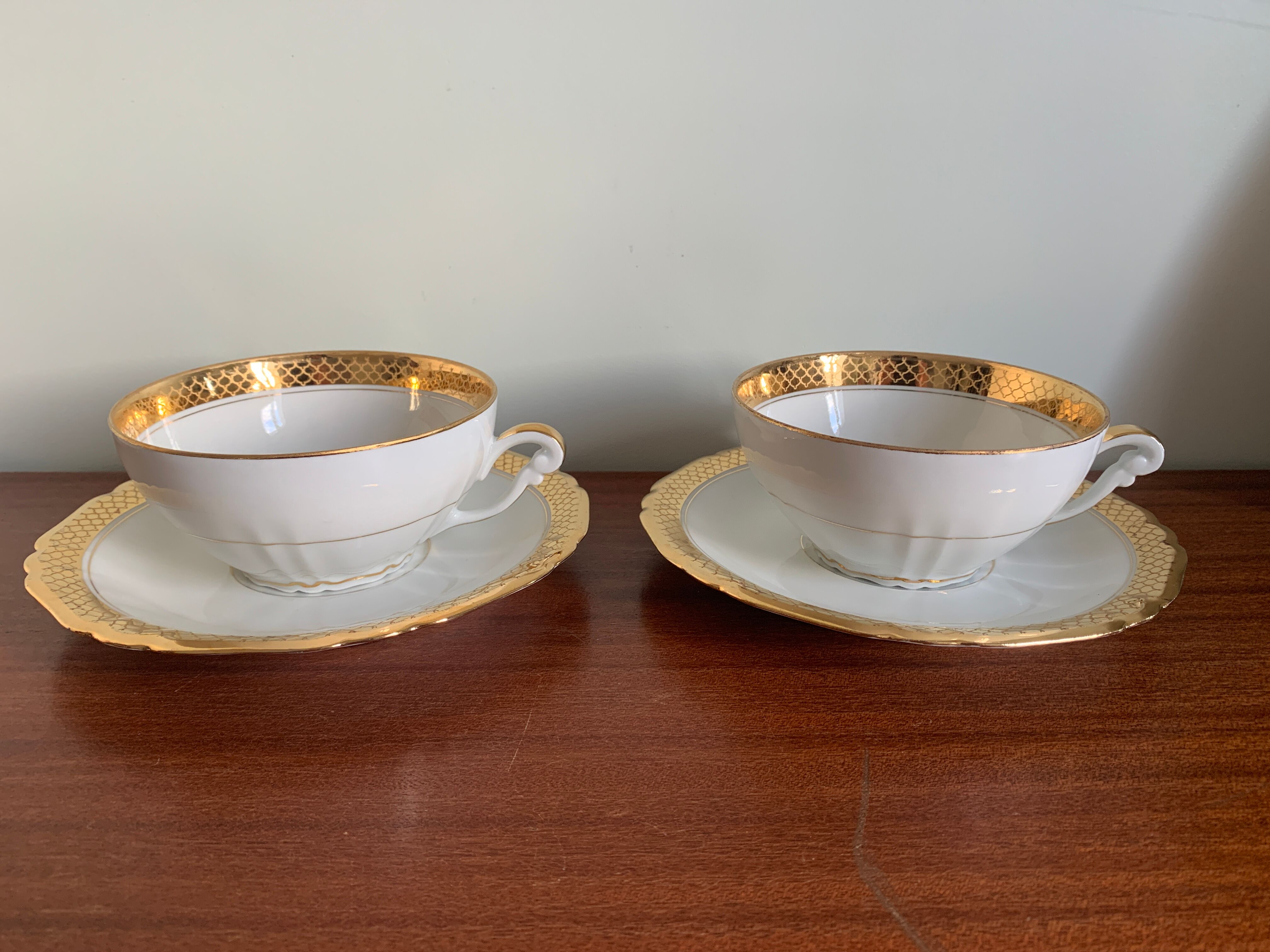 Pair of gold porcelain tea cups