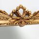 Highly decorated gilted carved wooden wall mirror, Belgium ca. 1950