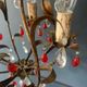 Antique chandelier in gilded sheet metal and red and white crystal pendants, 1900