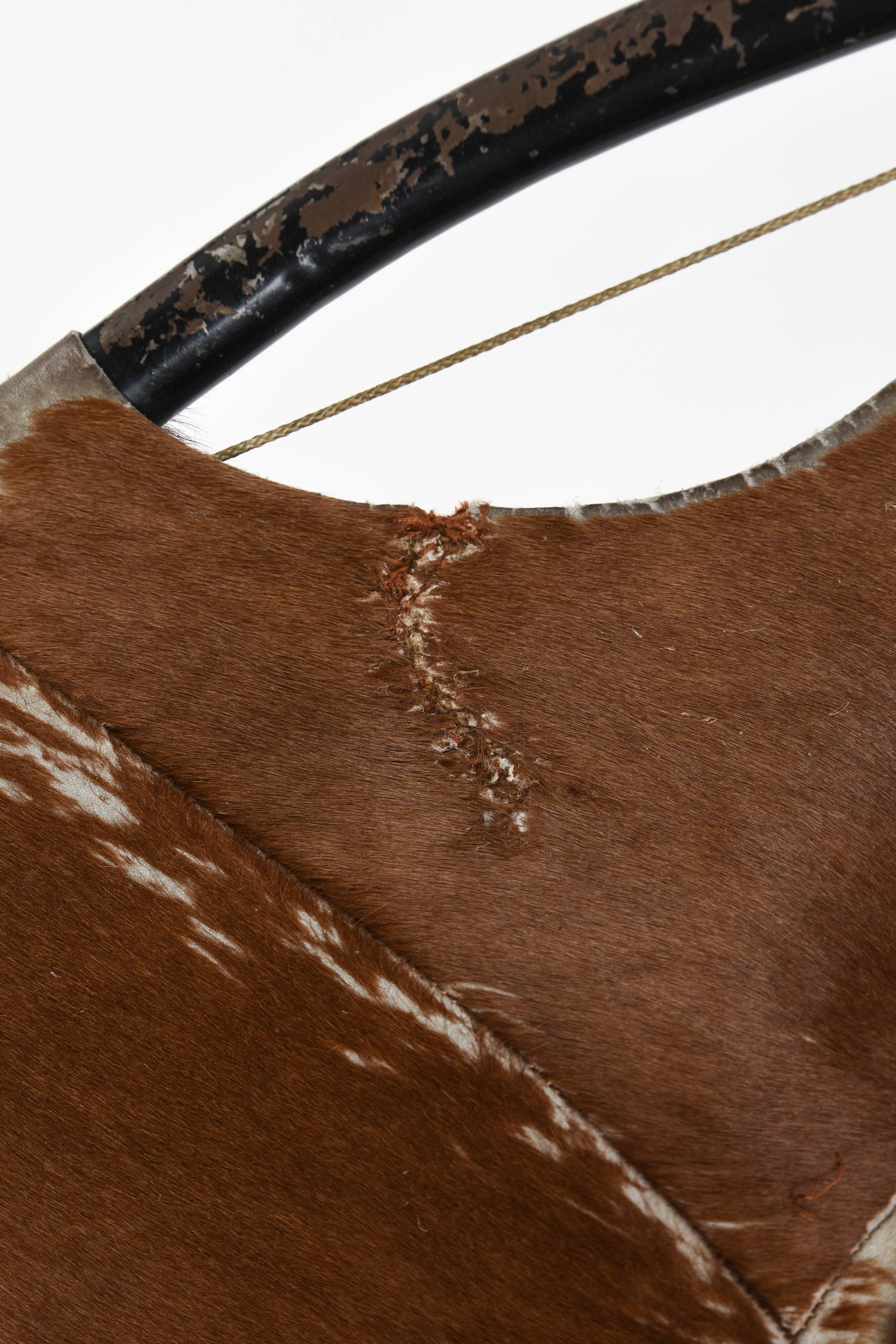 Cowhide armchair, circa 1960