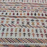 White carpet with multicolored Berber patterns
