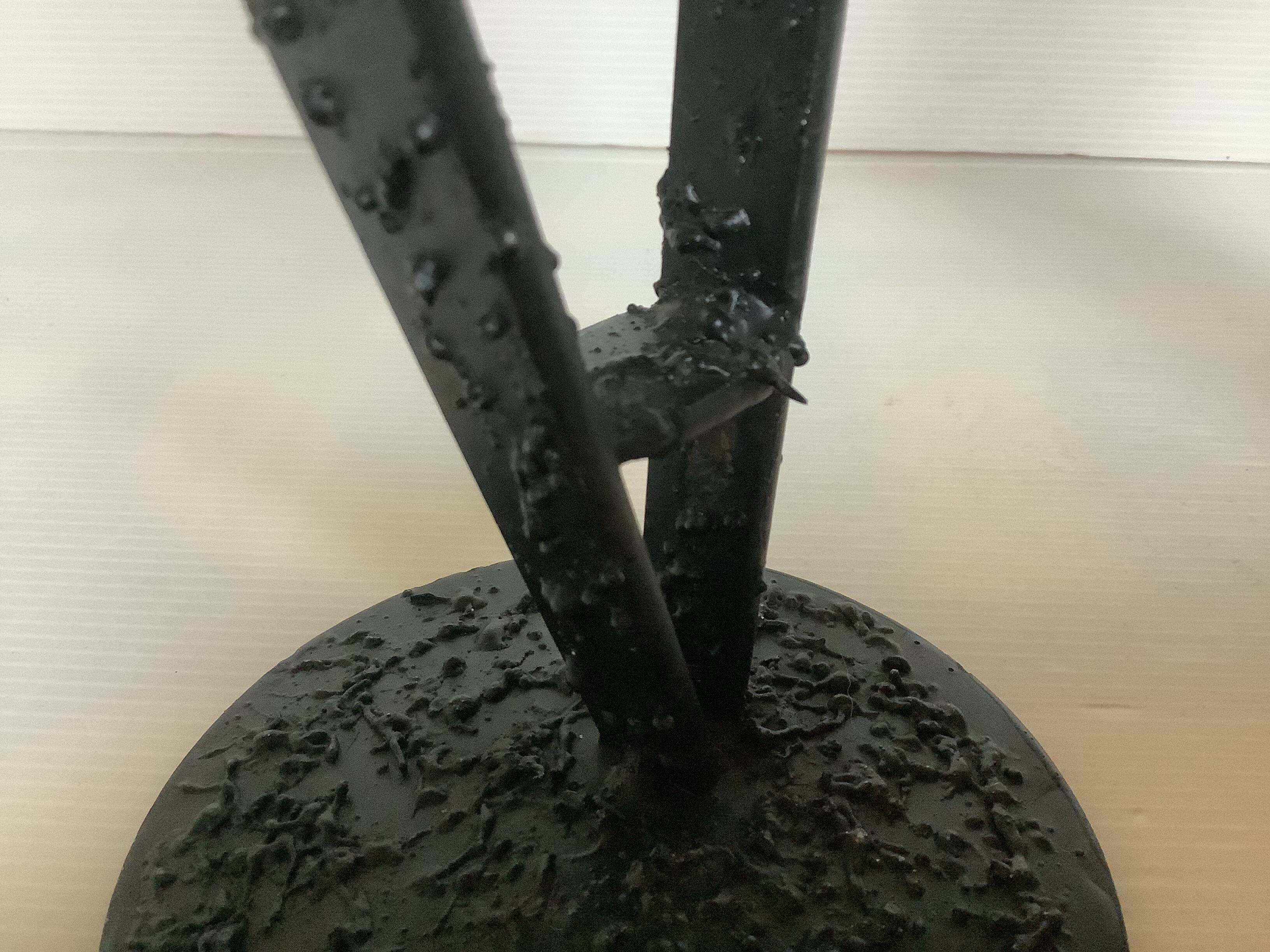 Pair of black metal candlesticks