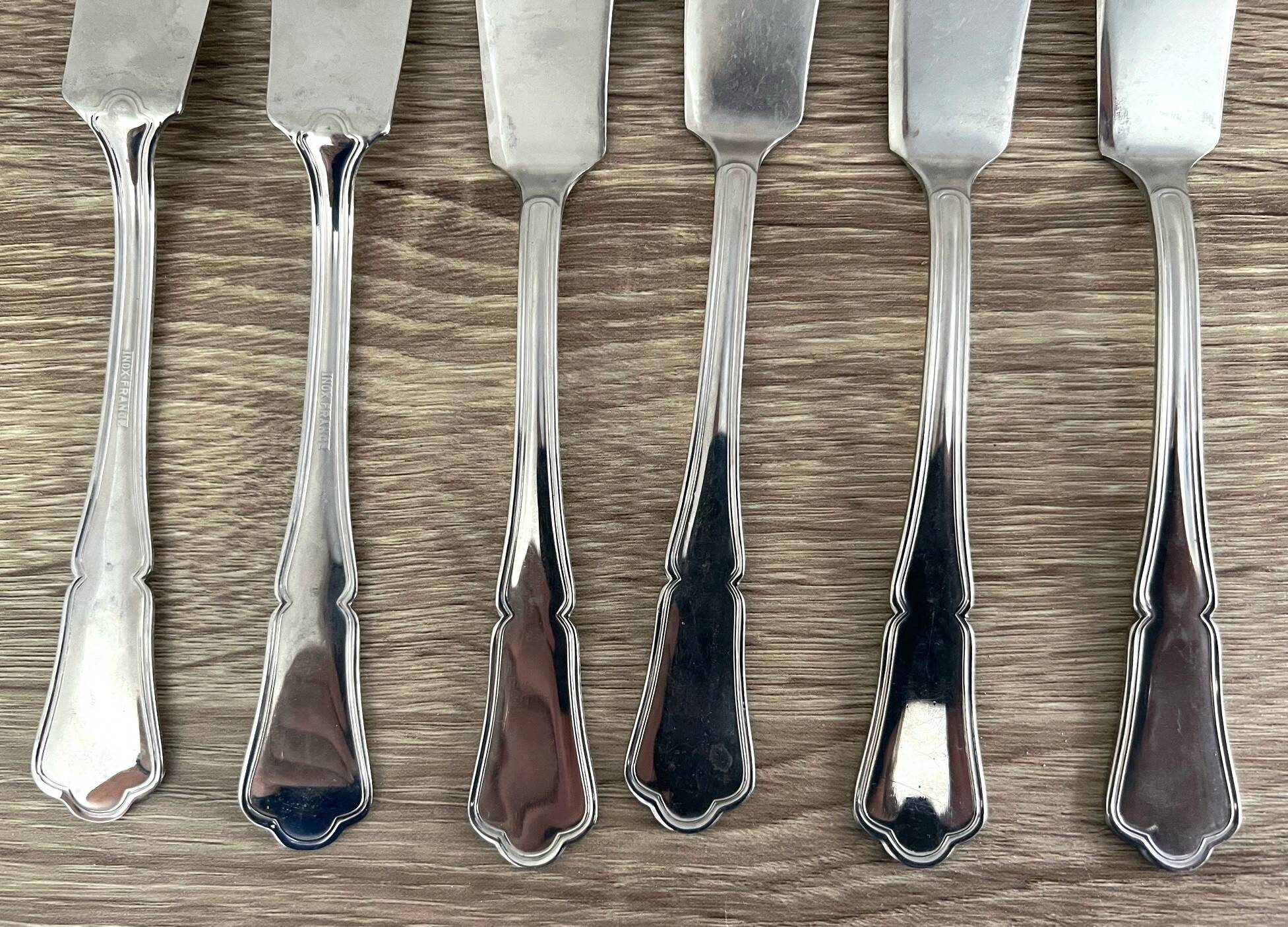 14 fish cutlery sets, 6 forks, 6 knives, 2 stainless steel serving cutlery sets