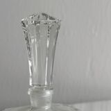 Small transparent faceted glass bottle