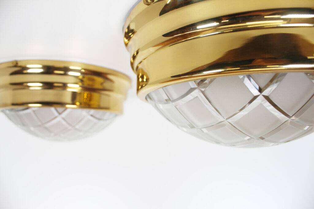 Pair of vintage brass ceiling lights with glass globe