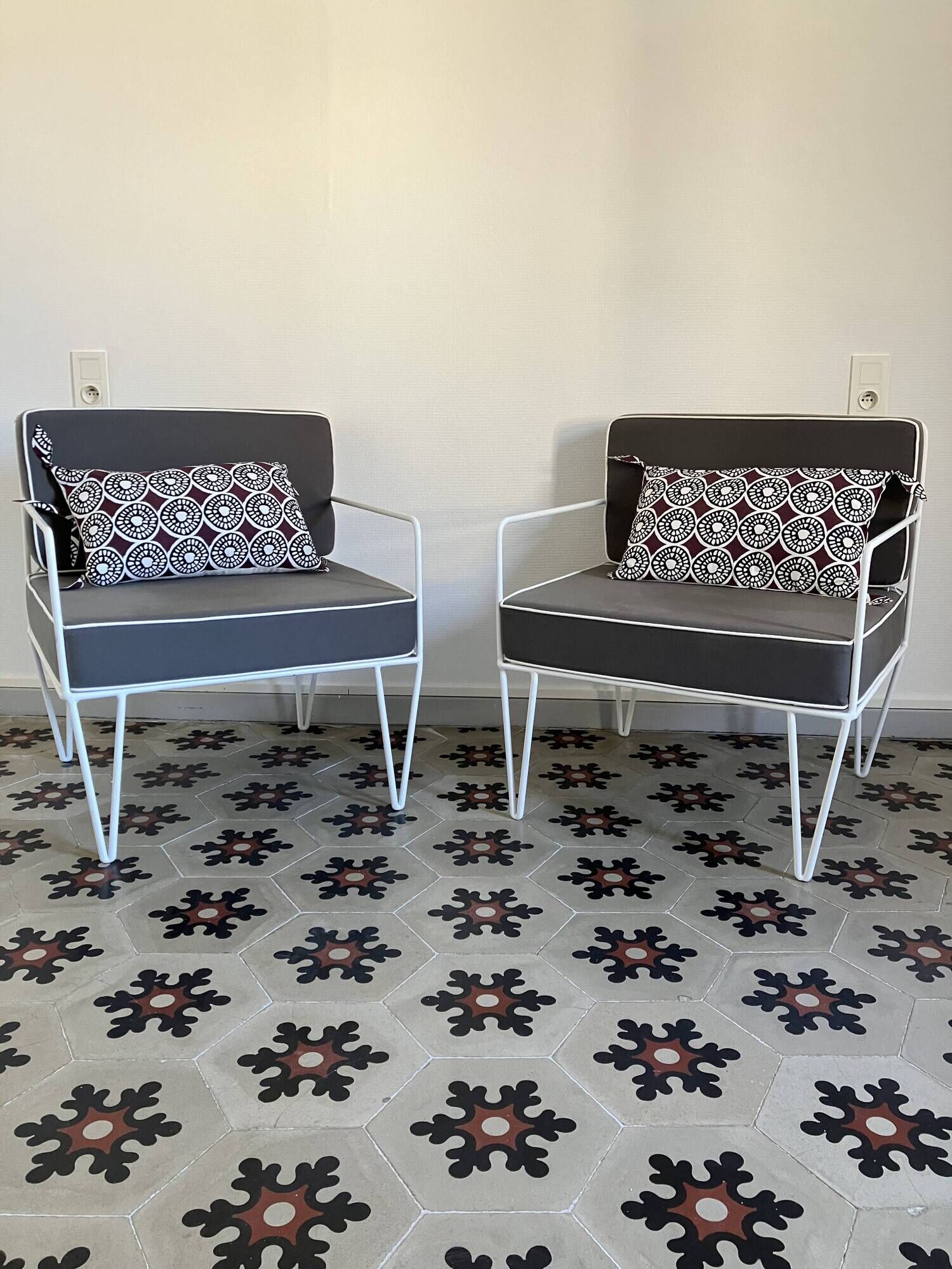 Vintage white metal Croisette style armchairs with hairpin legs in superb condition