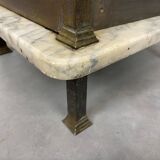 Brass bedside table with a marble top.