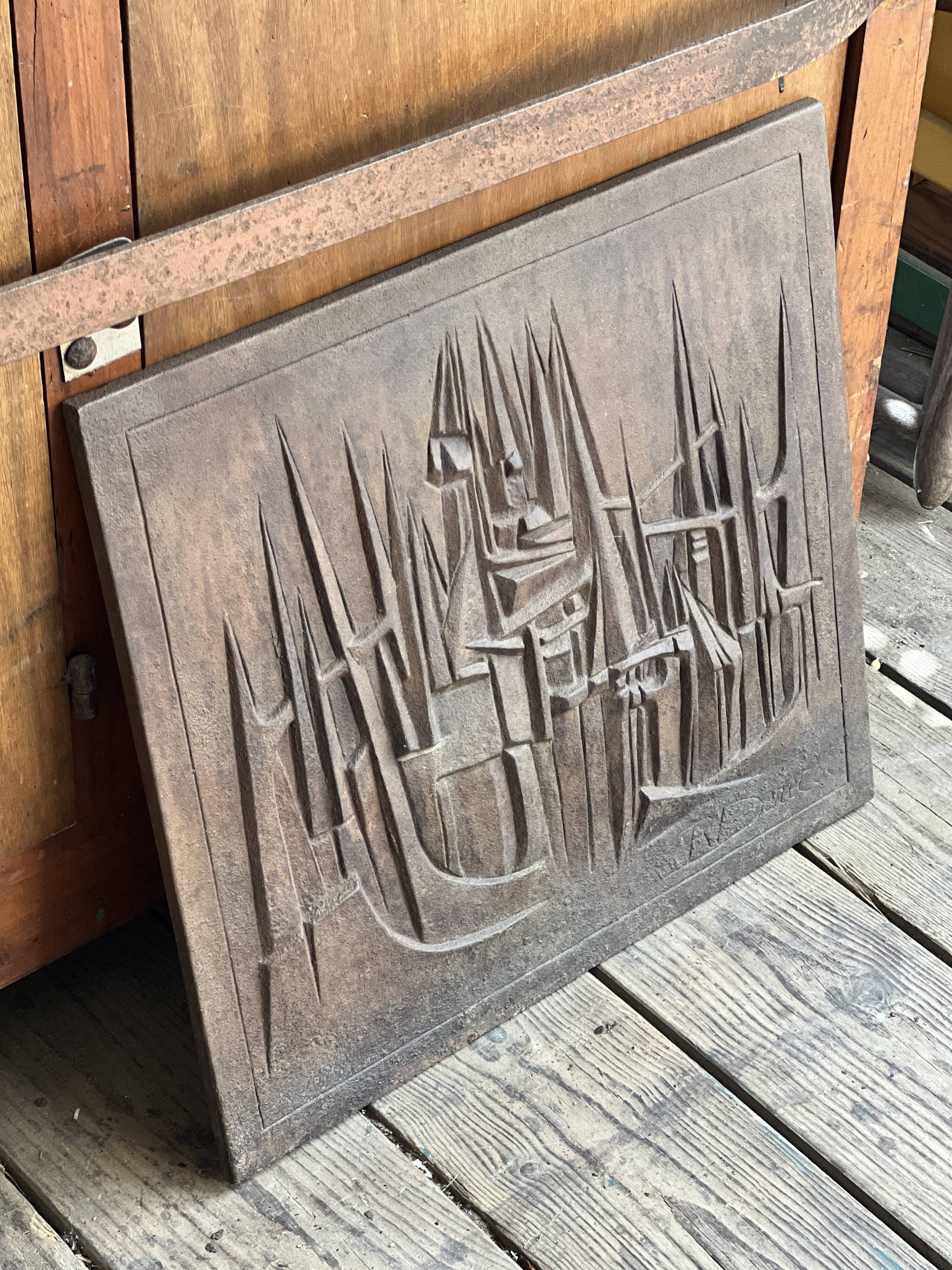 Cast iron plaque signed