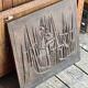 Cast iron plaque signed