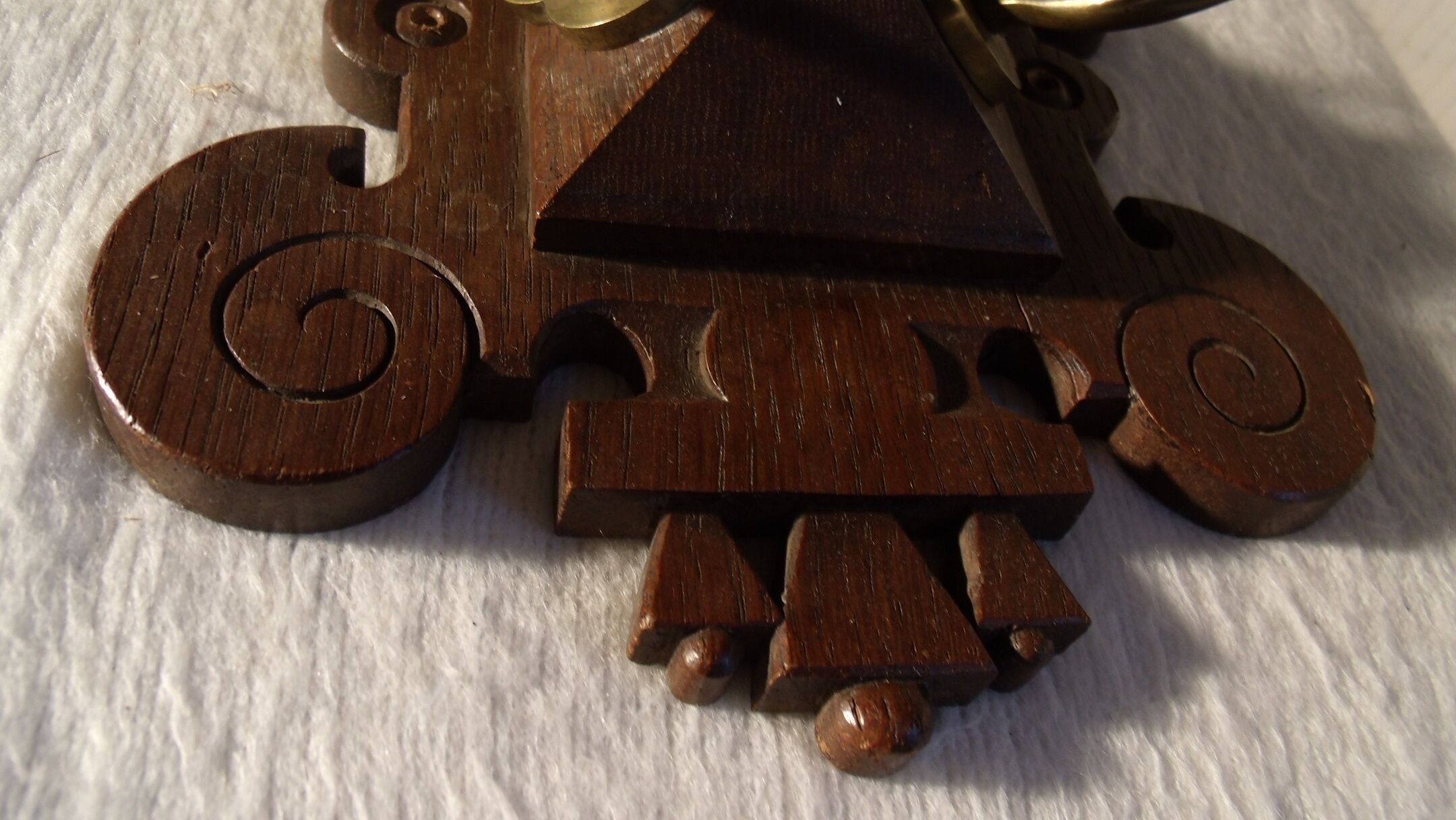 Former wooden and brass wall coat racks