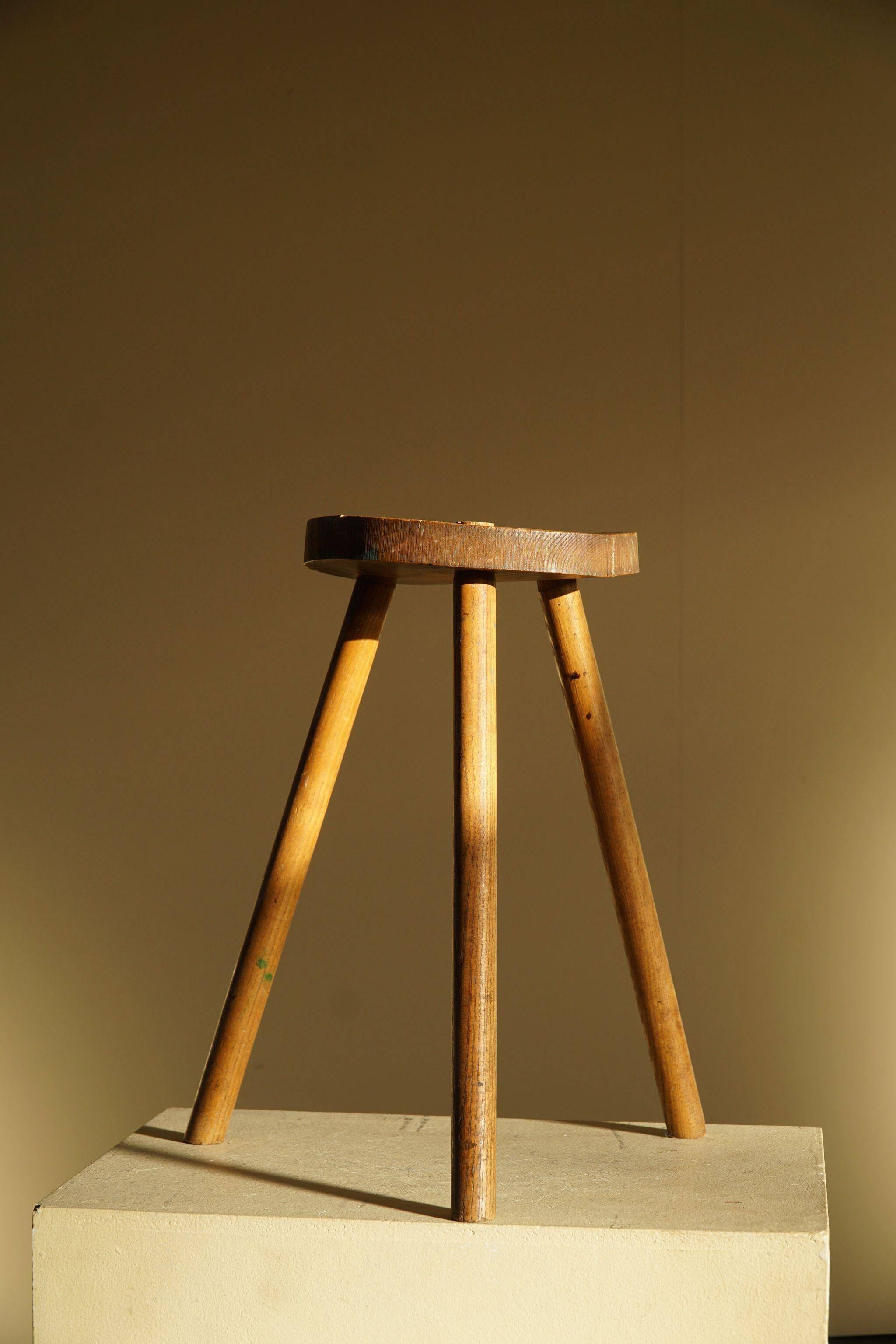 Tripod stool made of solid oak, by a Danish cabinetmaker, mid-century, around 1960.