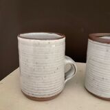 2 Mugs in Sandstone.Roger Jacques St Amand .vintage