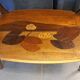 Art Nouveau coffee table with marquetry.