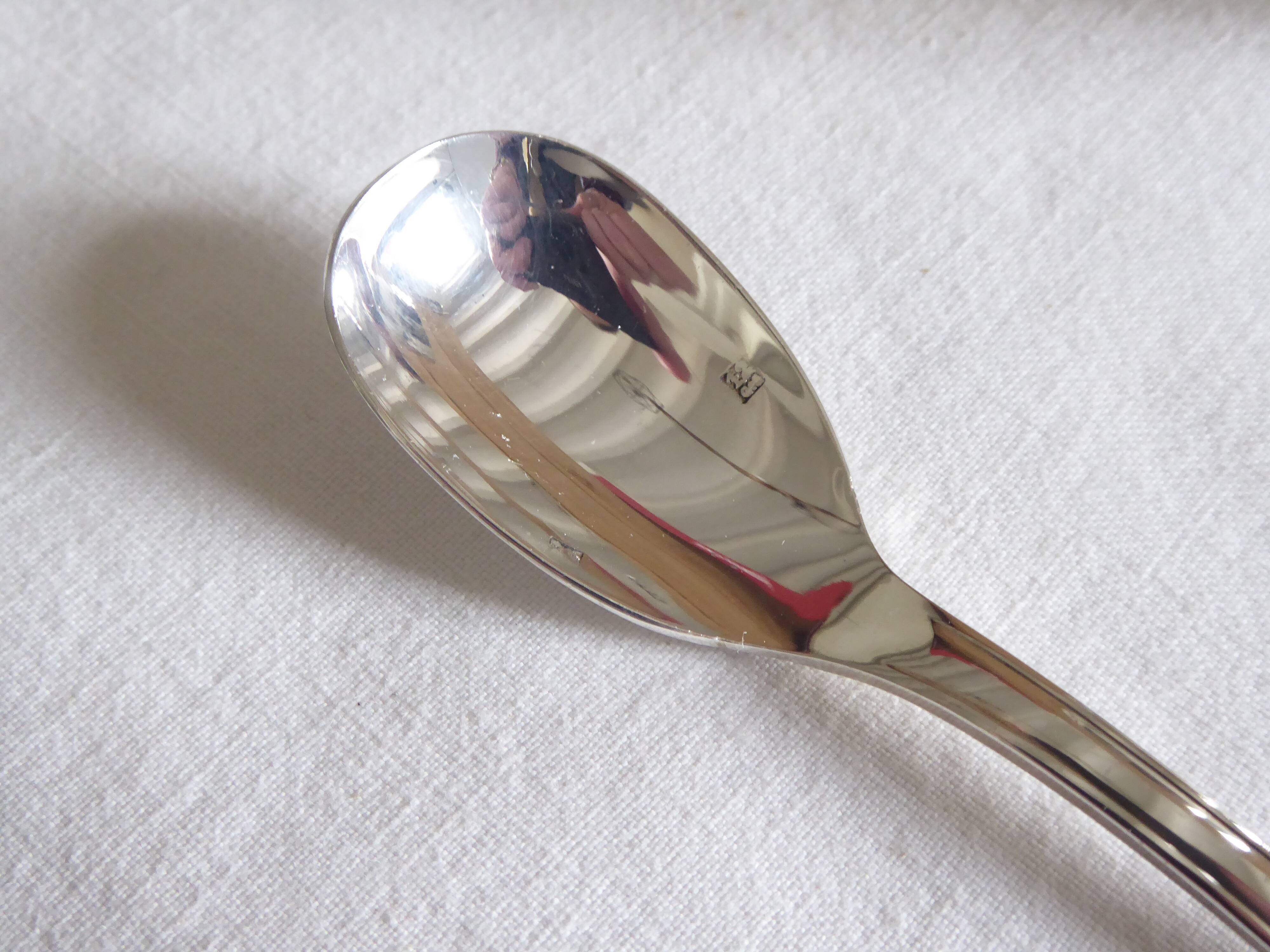 Cockerel + silver metal spoon