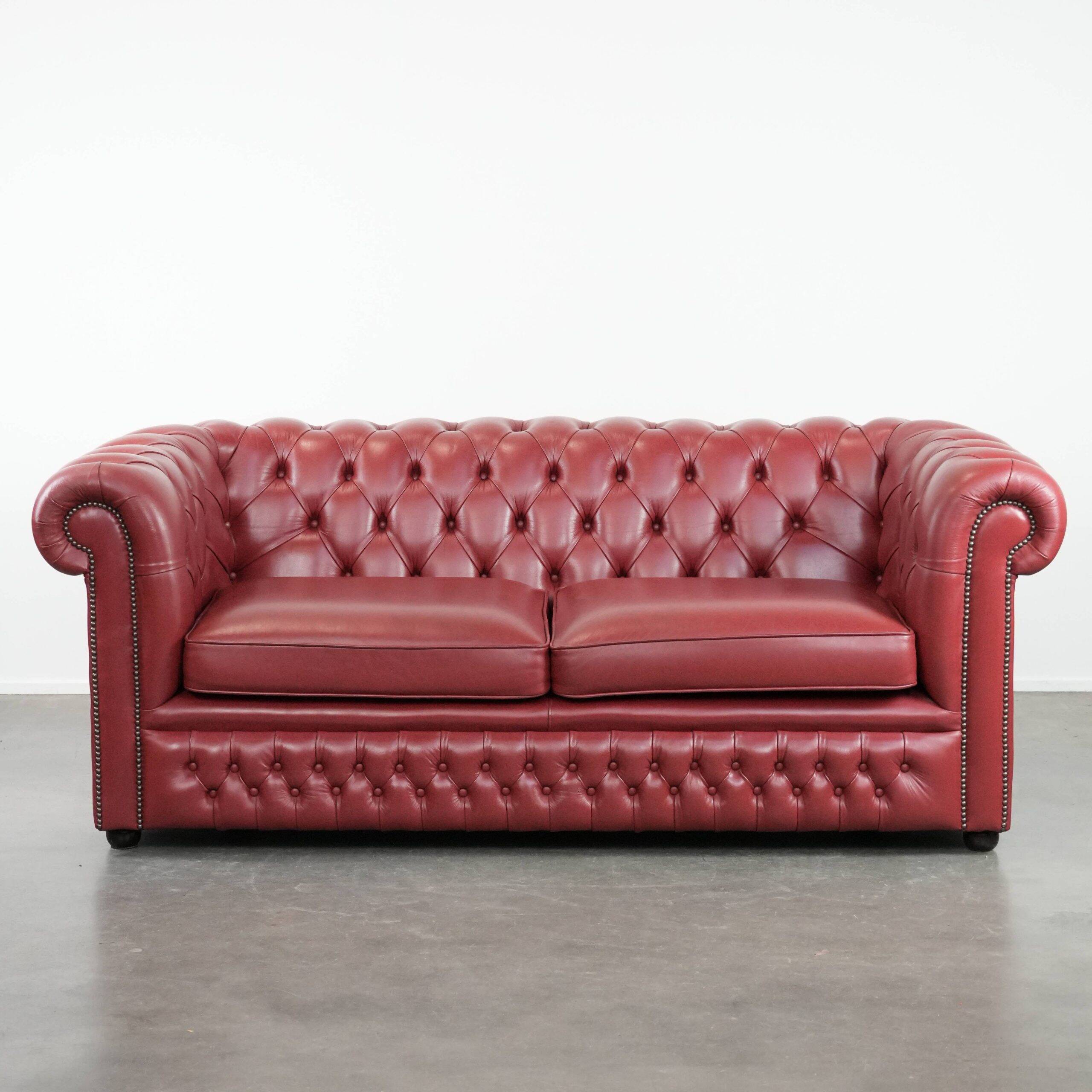 English cowhide Chesterfield 2.5-seater sofa in a stunning red colour