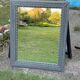 Pair of large sculpted mirrors in painted grey wood, antique style (1900s)