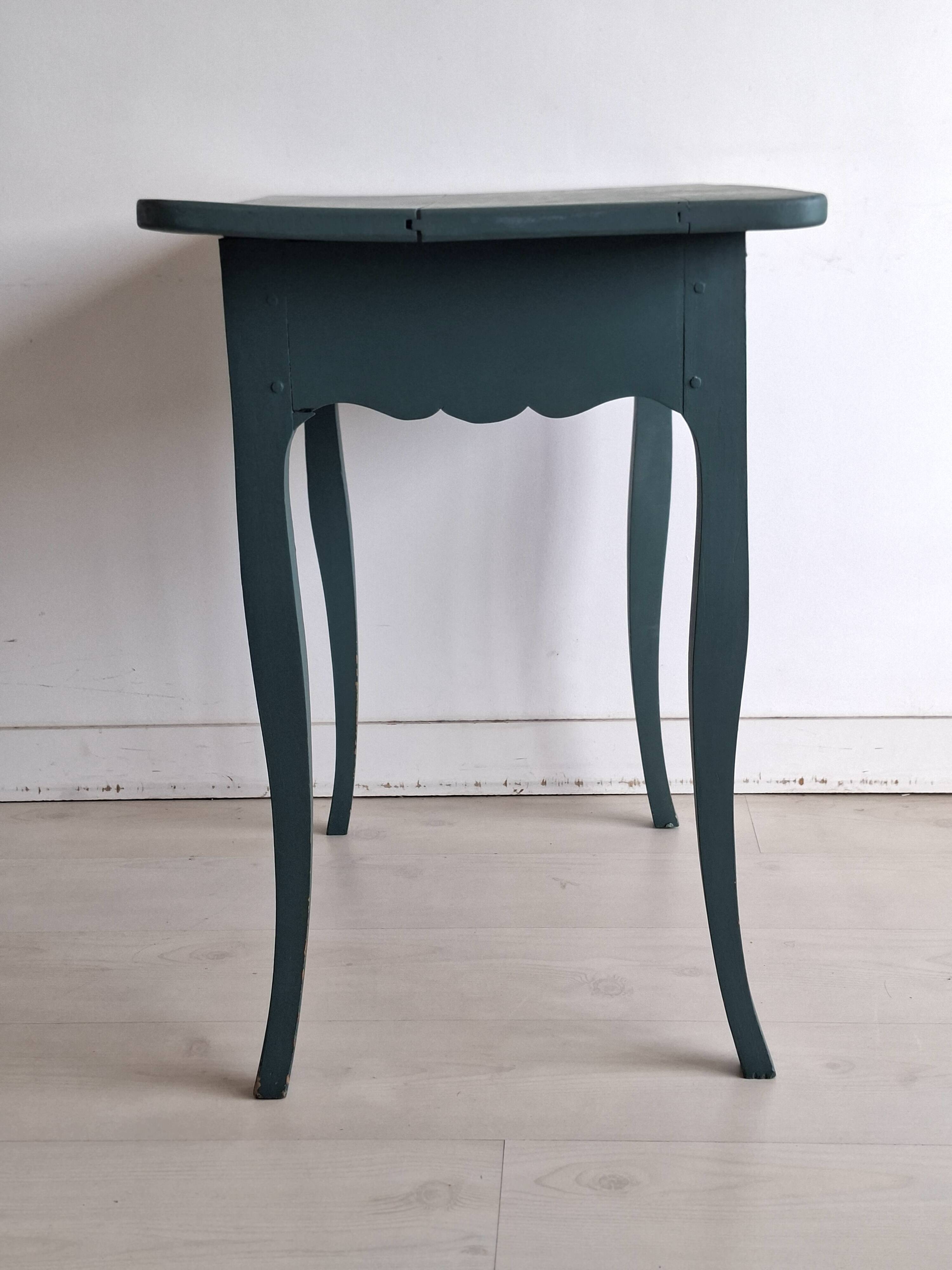 Antique Gustavian-style table painted in dark green with a drawer.
