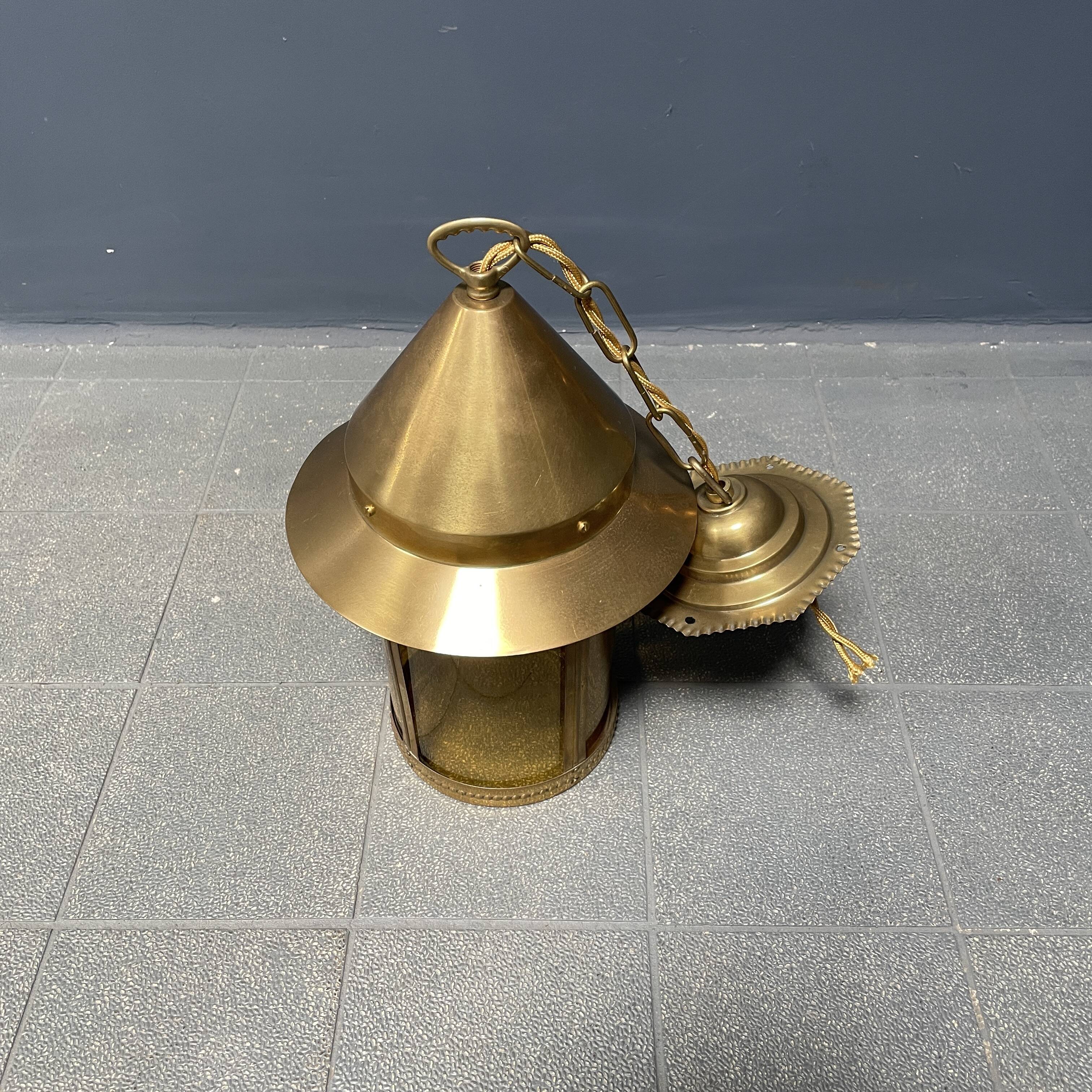 Brass lantern pendant lamp with yellow glass