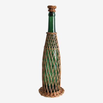 Glass and wicker bottle