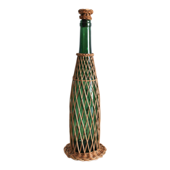 Glass and wicker bottle