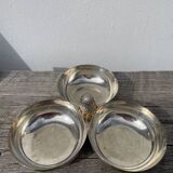 Silver-plated metal dish topped with an acorn