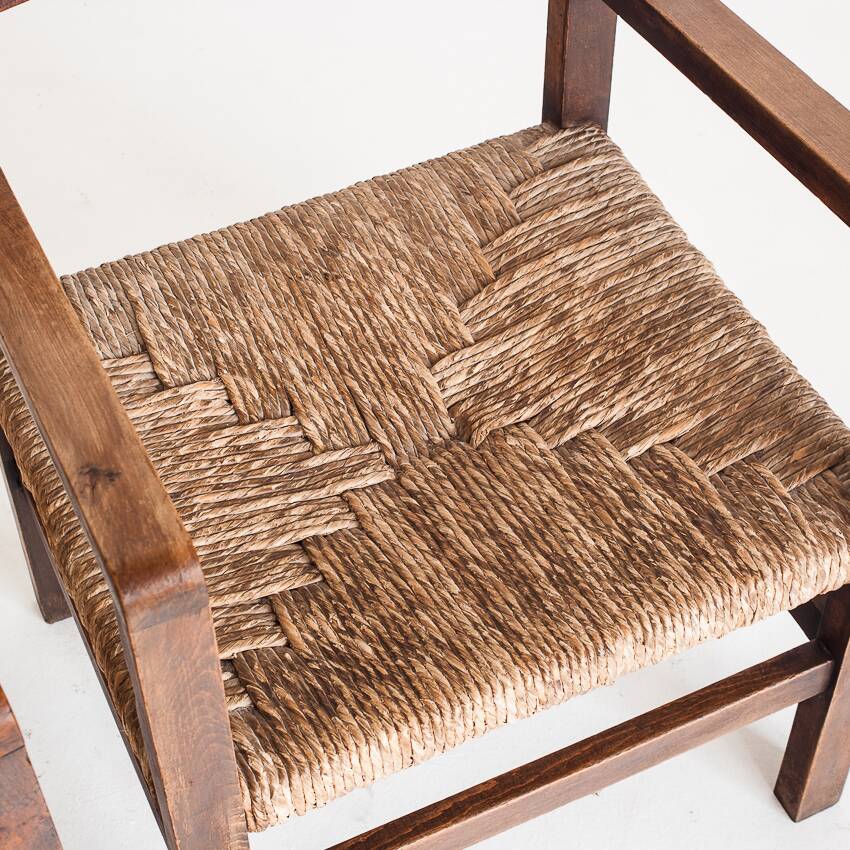 Pair of rustic armchairs in solid wood and straw seats. France, 1940s