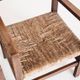 Pair of rustic armchairs in solid wood and straw seats. France, 1940s