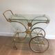 Neo classical style table in silver and gold metal and glass