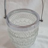 Ice bucket and spoon thereon