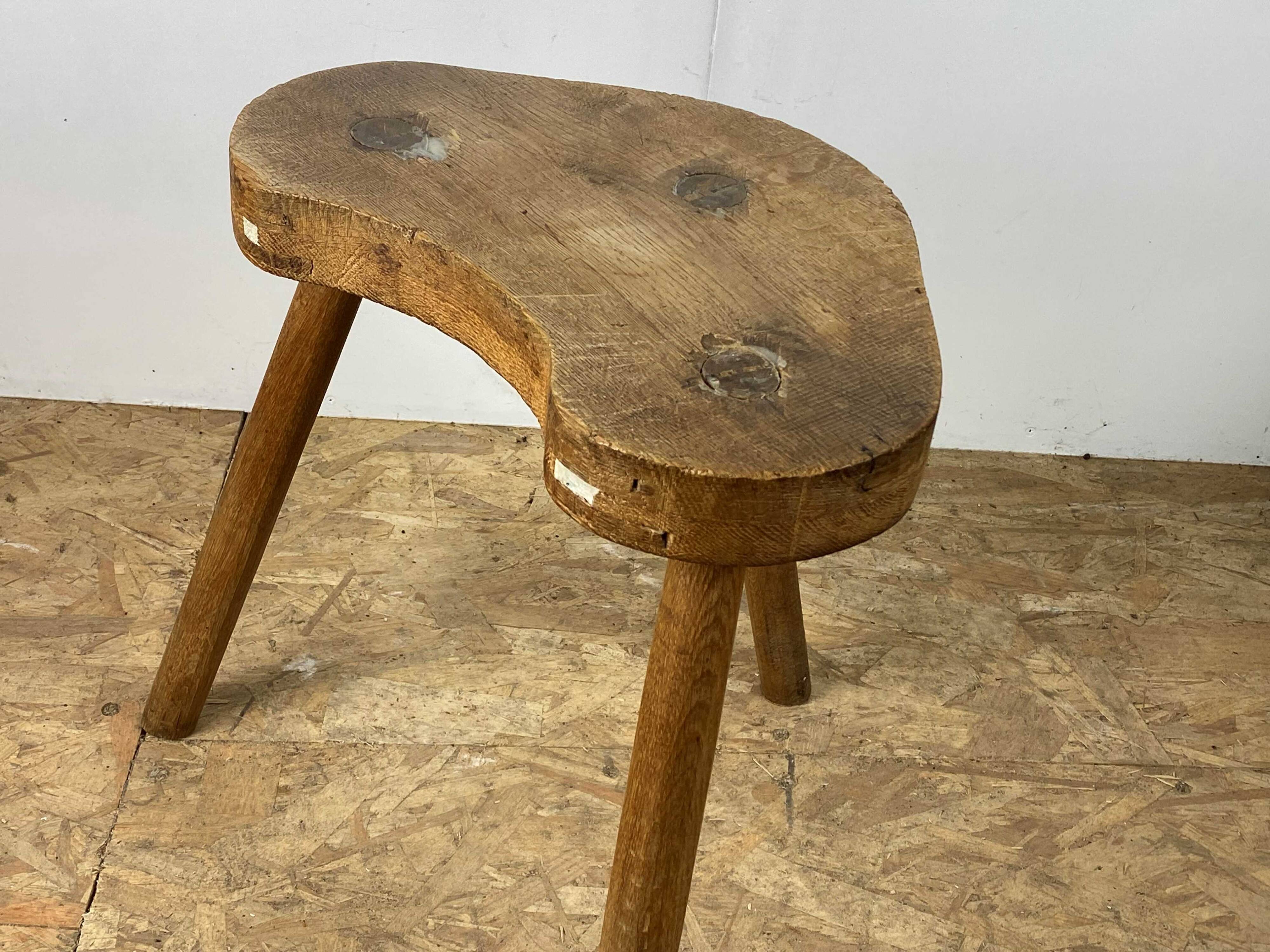 Set of 6 brutalist solid oak tripod farm stools from the 1950s