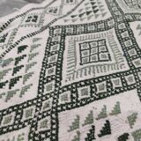 Handwoven white and green rug