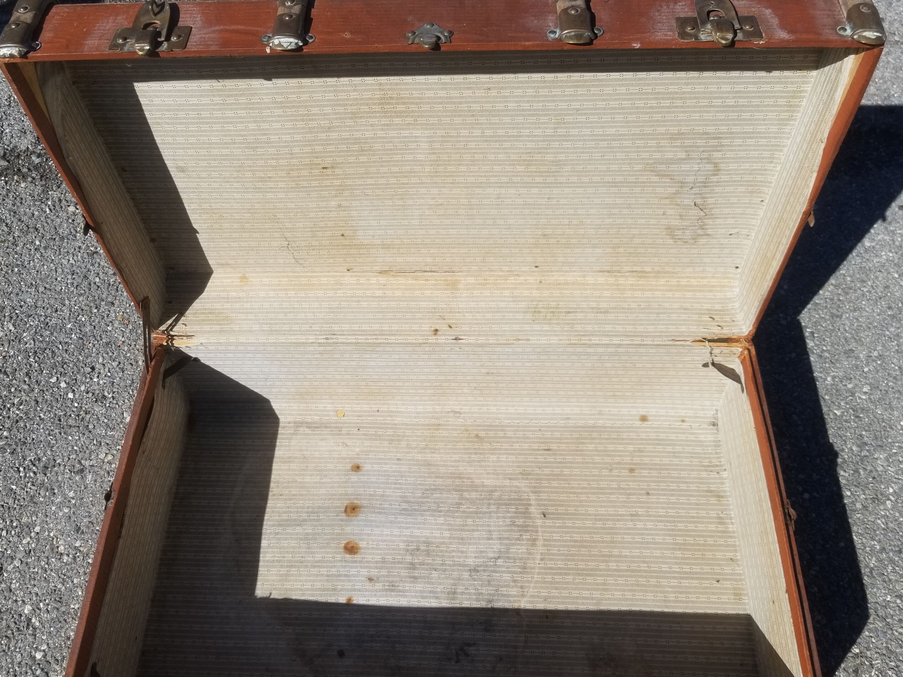 Old travel trunk made of wood and brass