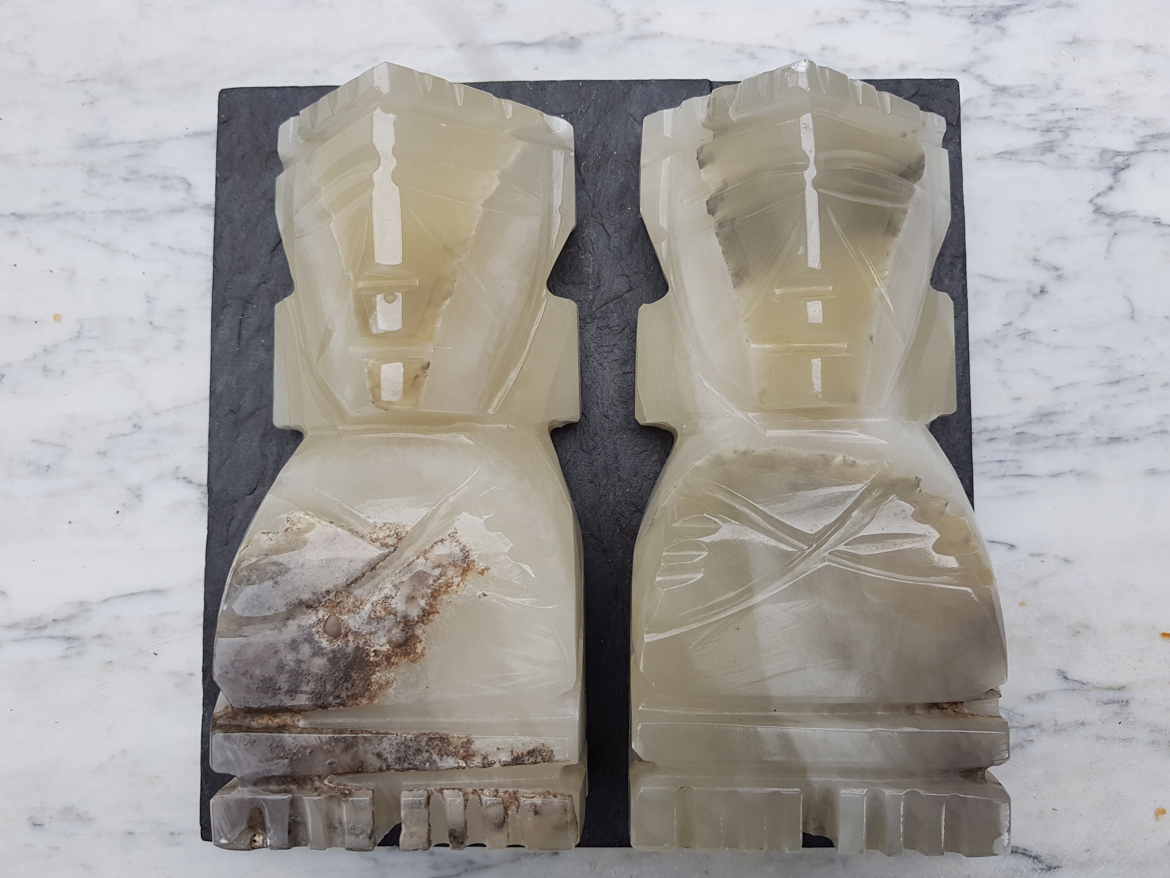 Onyx book clambands depicting an Aztec statue