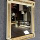D'après Versace : miroir style Consulat en bois laqué et doré