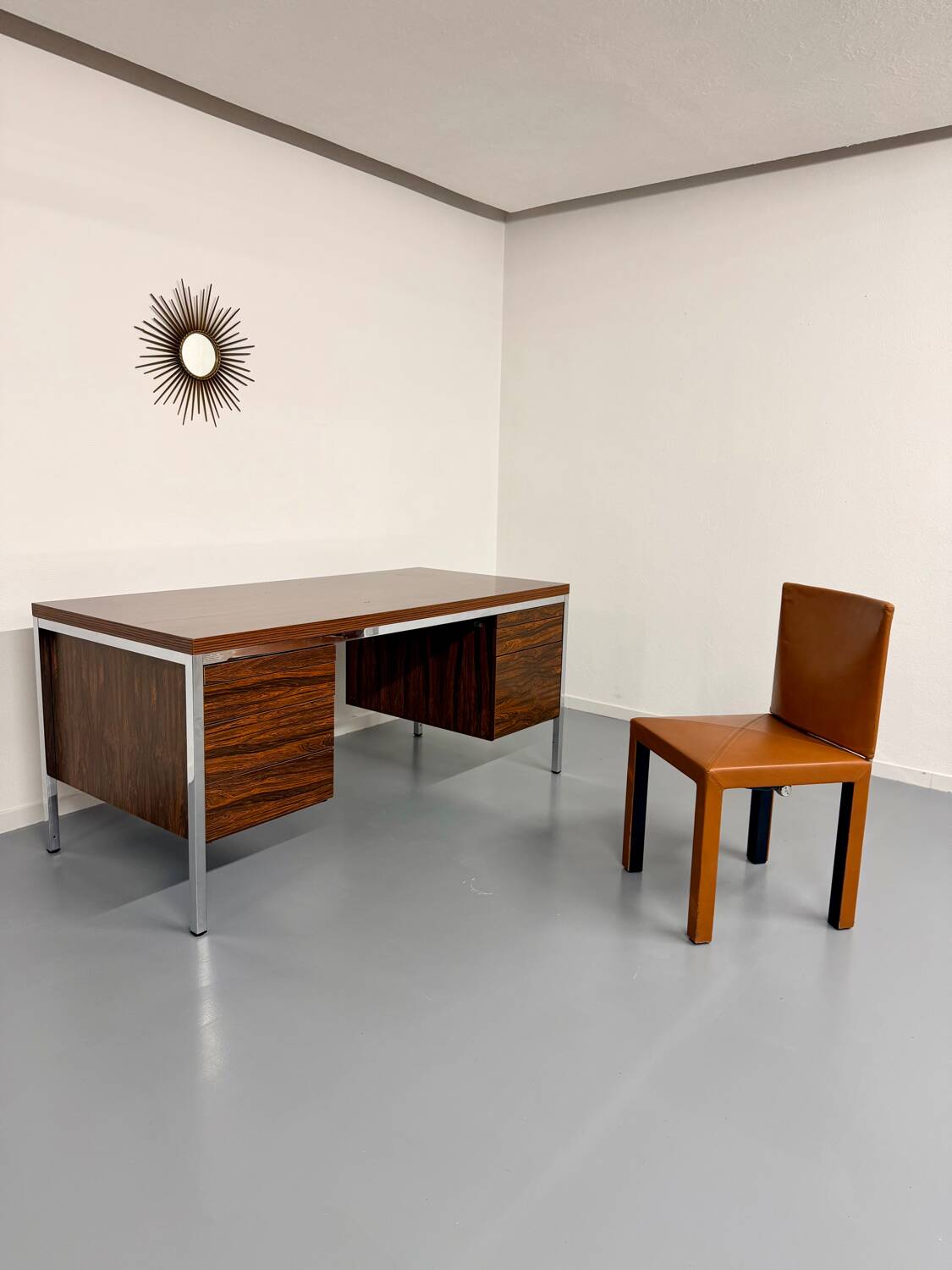 Vintage desk with rosewood veneer and chrome metal design from the 1970s.