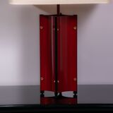 Red metal sculptural table lamp with oversized lamp shade circa 1980