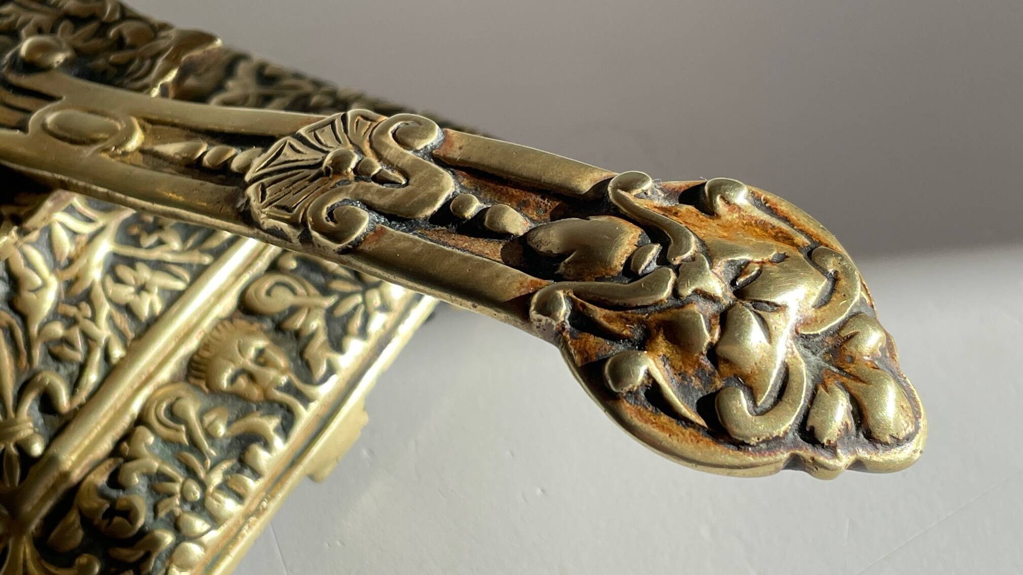 Patterned solid bronze hand candle holder