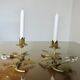 Pair of gilded metal candle holders and tassels