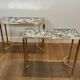 Pair of brass and antique mirror side tables from the Baguès house.
