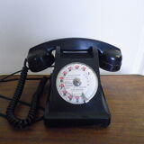 Black bakelite phone with earphone