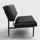 Modernist armchair in black faux leather and metal – 1960s