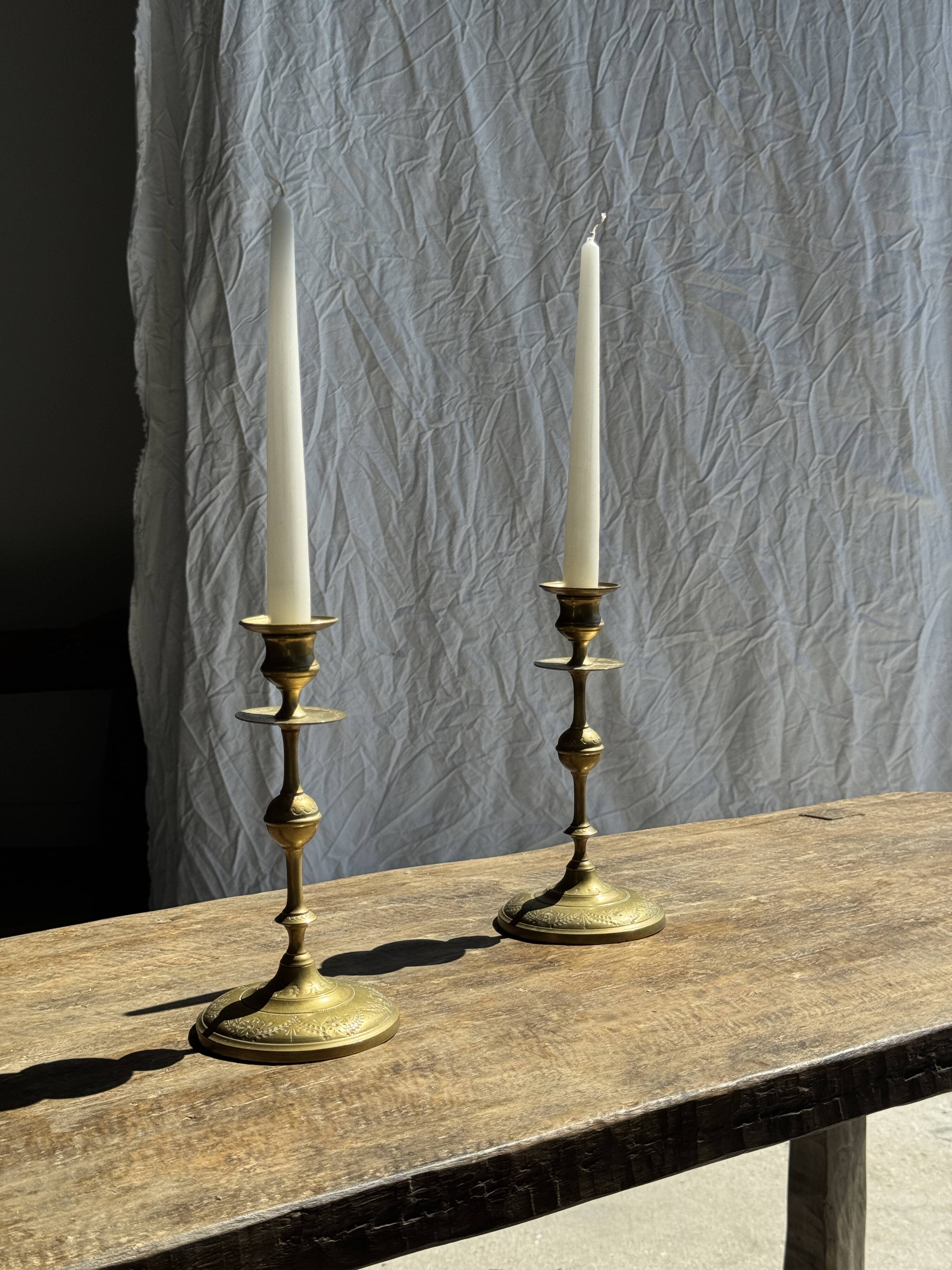 Pair of gilded candlesticks with engraved flower garland motifs H22