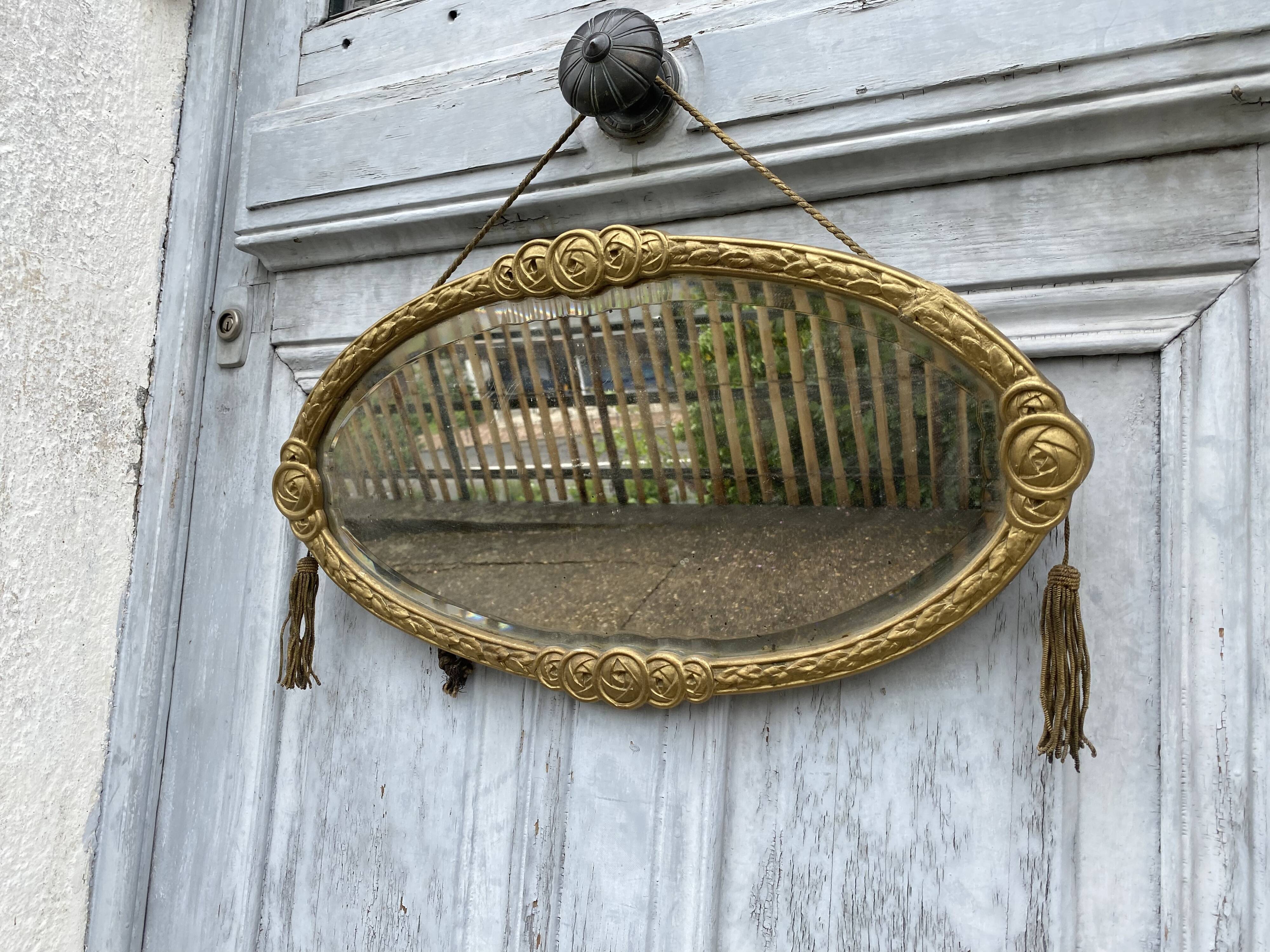 Miroir ovale art déco avec pompons