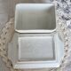 Large vintage earthenware and slip butter dish with fruit motif